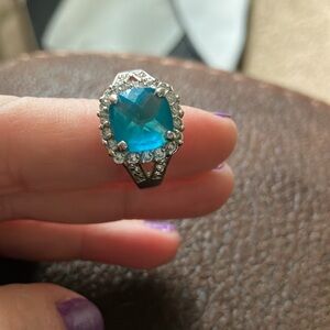 R..C. Ring with silver tone, C.Z.’s white and blue